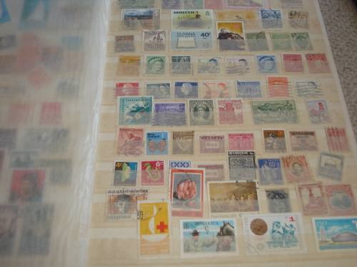 WORLD COLLECTION IN TWO STOCK BOOKS-ANYTHING COULD BE IN THESE !! READ BELOW