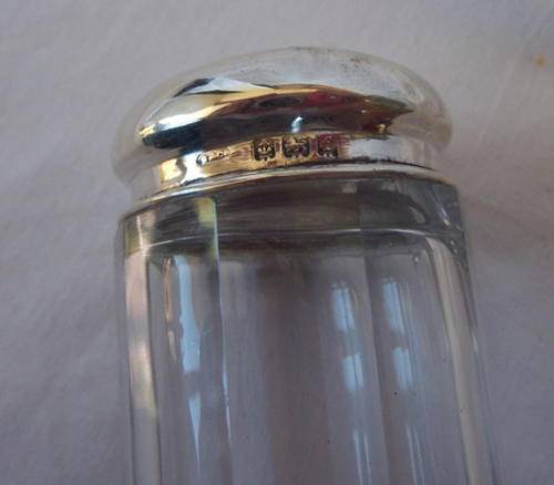 PRETTY HALL MARKED SILVER AND CRYSTAL VANITY BOTTLE - WITH AN ANGEL STAMPED ON THE TOP - MADE I