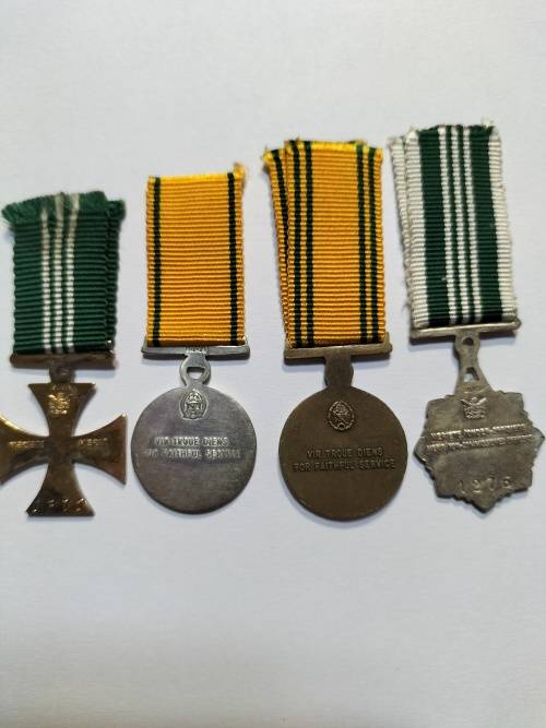 Miniature Correctional Service medals, documentation book and name badge