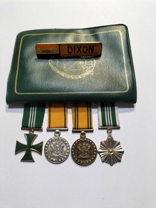 Miniature Correctional Service medals, documentation book and name badge