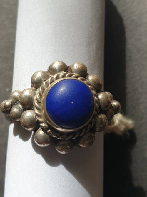 silver ring with a blue stones stamp 925