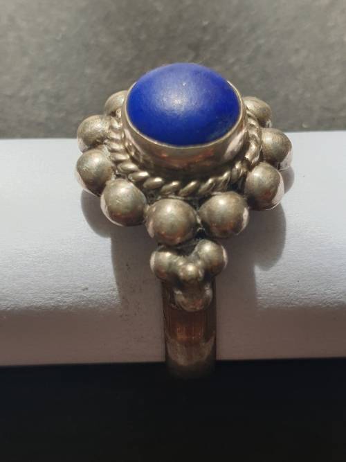silver ring with a blue stones stamp 925