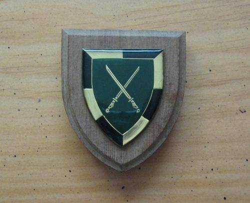 SA ARMY INFANTRY SCHOOL SHOULDER FLASH mounted on a wooden shield