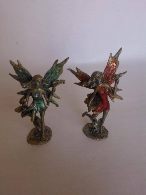 Pair of detailed metal fairies