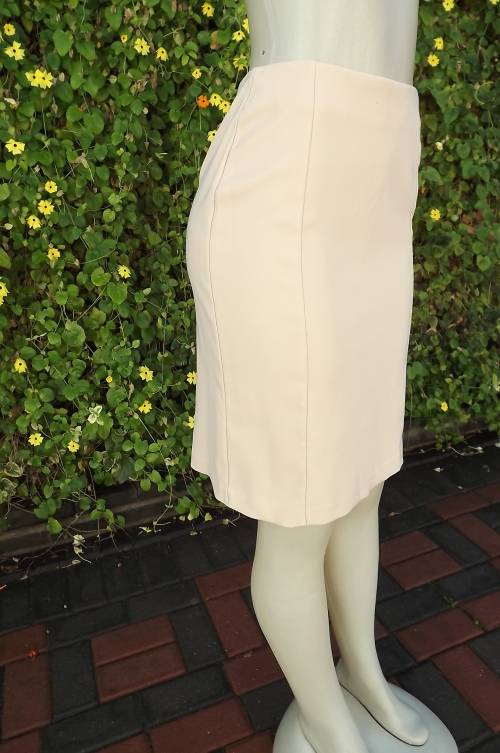 Sexy but smart beige panelled pencil skirt.Knee length by Truworths size 34/10.Without waistband.