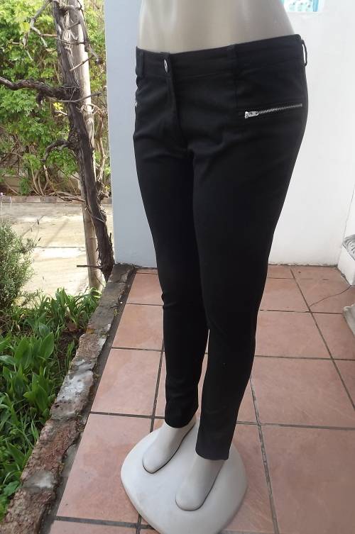 Skinny leg black stretch cotton RT pants in size 36/12.Two zipped dummy pockets on front.
