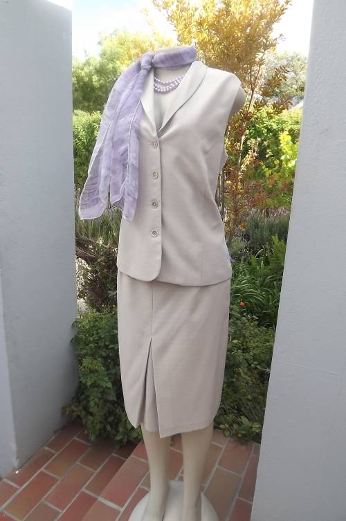 Summer 2 piece beige outfit by Truworths in size 38/14.Calf length skirt with inverted pleat