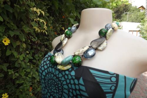 Modern bulky necklace with large striking blue and green colourful beads.Will transform your dress