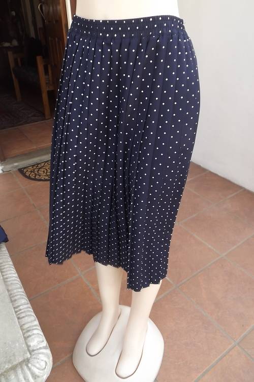 Smart navy with white polka dot wash + wear polyester skirt.Permanent knife pleats size 48/24