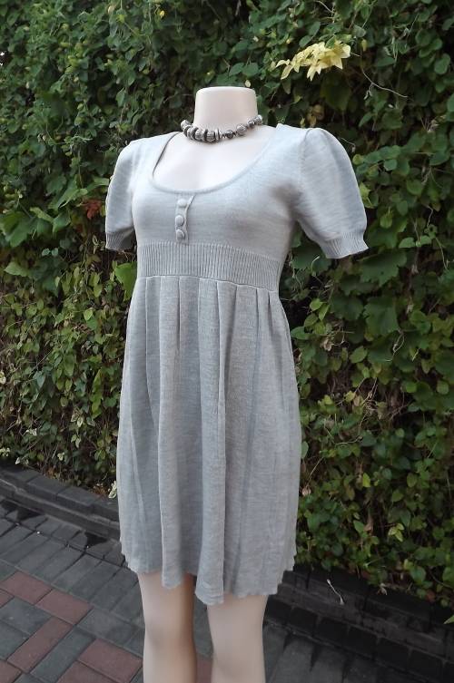 Silvergrey knitted dress in size 30/6 by FROM LOVE THREE.In acrylic knit.Pleated skirt