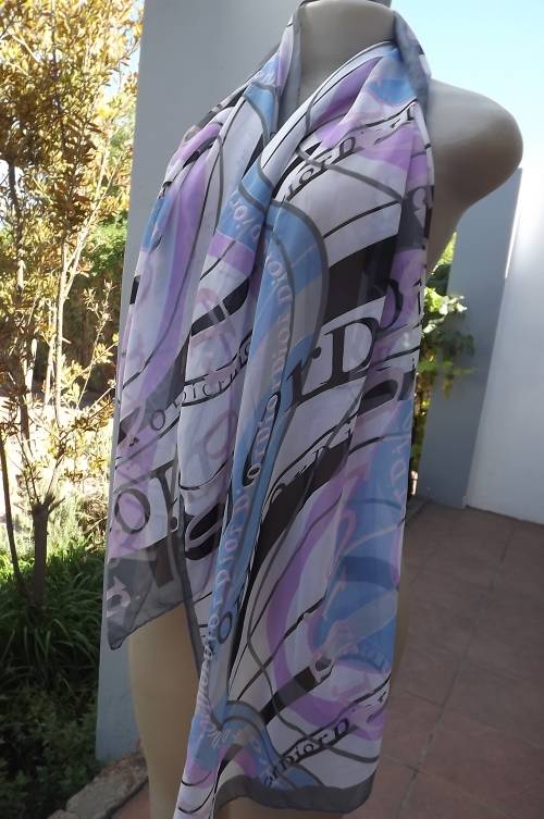 Stunning sheer scarf in white with violet and blue and black Dior logos.Length 160cm width 50cm