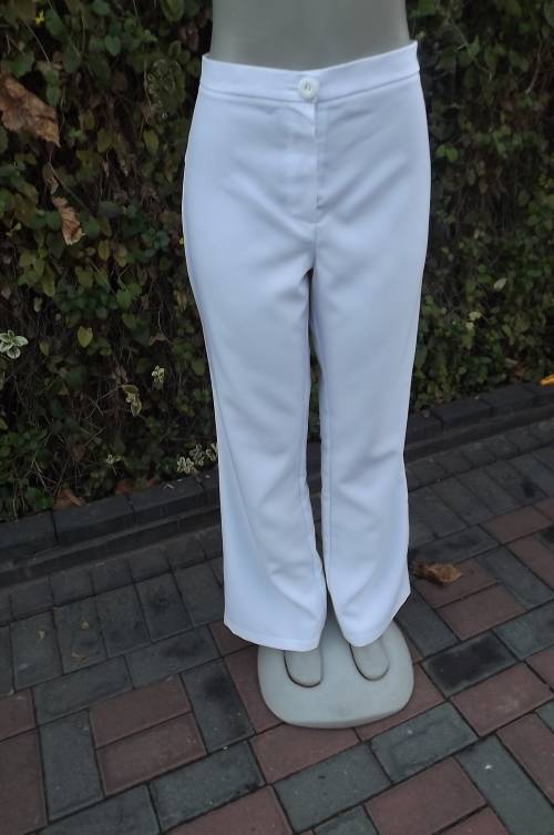 As new snow white ladies pants in size 38/14 by FASHION EXPRESS.Bootlegged.In 100% polyester