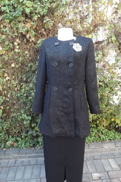 Luxury black glam double breast jacket in size 33/9.Collarless with long sleeves.As new