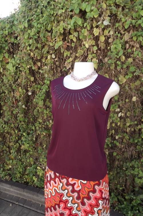 Maroon sleeveless slip over top in stretch polyester with embellished neckline.Size 37/13