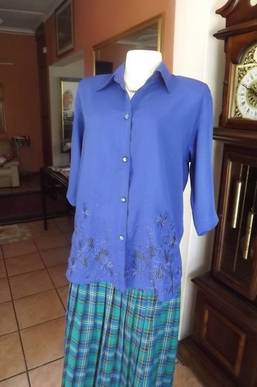 Beautiful royal blue short sleeve top by PIKO with embroidered front.Size 40/16.Good condition