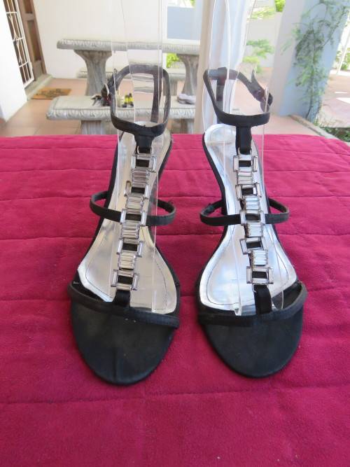 Pair of black high heel sandles with ankle straps in size 5 by FOSHINI GLAMOUR