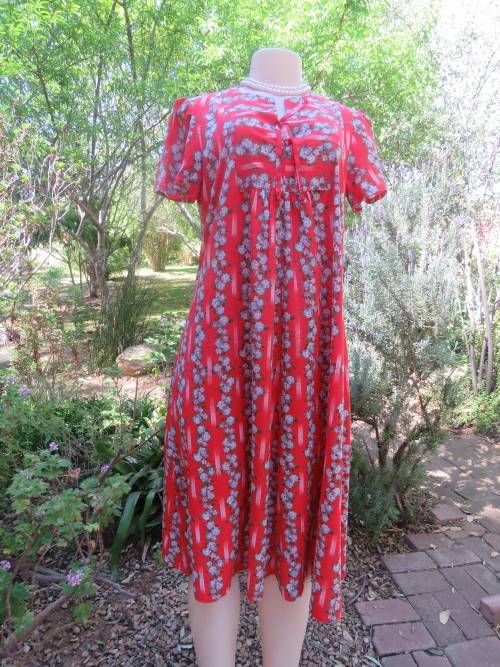 Buttersoft and silky boutique made red and blue floral striped maternity dress.Size 34/10