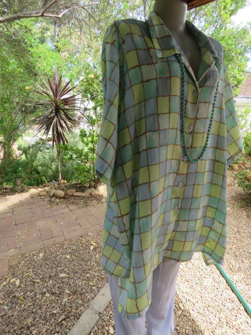 Short sleeve JUDY'S PRIDE button down top in blue and green small colour blocks.Size 54/30