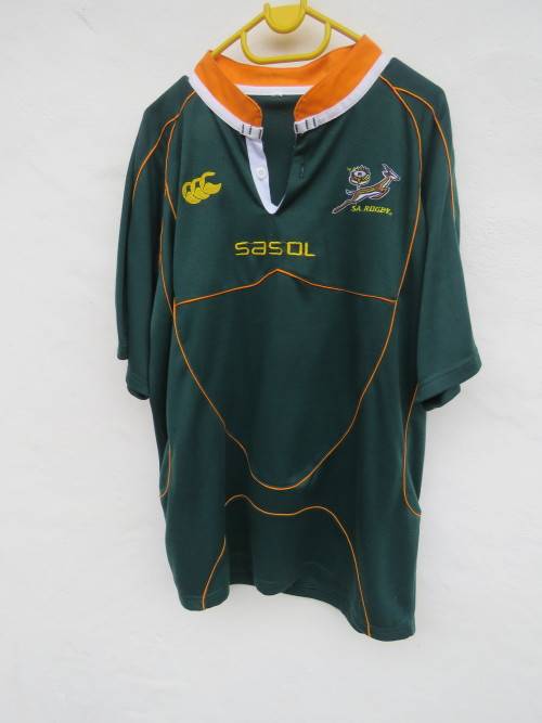 Green and gold Springbok Rugby top with high collar.Size L.Chest 116cm with gold cord trimmings