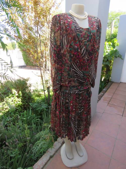 Dark patterned sheer silky 100% polyester vintage dress with dropped waist.Size 36/12 By MISS LYNN