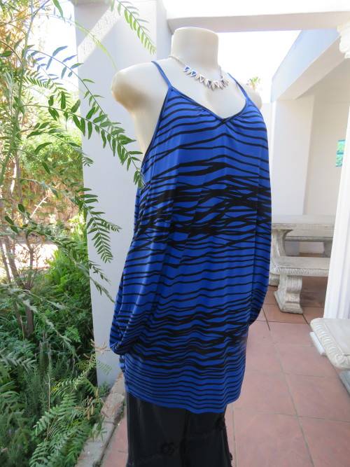 Sexy blue and black strappy long top with unique sides by RT in size 36/12.New condition