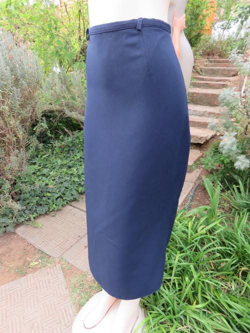 High quality navy blue DELSWA pencil skirt in size 38/14.In heavy 100% wash + wear polyester