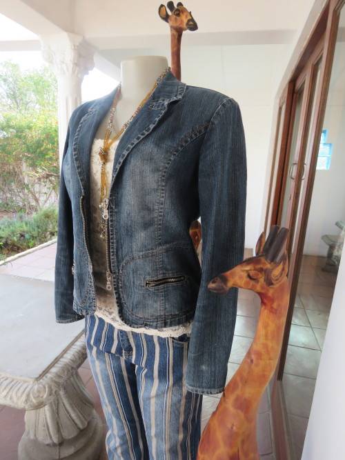 Chic jean denim jacket in 13/14 by 'COOL JEANS'.Zip up front.Distressed look.Good condition.