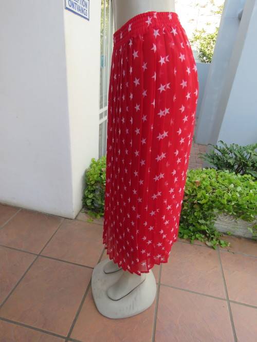 Irresistible red sheer polyester ankle length skirt.Size 36/12.Permanent pleated.New condition.