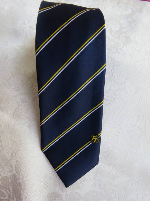 Men`s LOGO  FT dark navy tie with diagonal thin yellow and white stripes..Width 8cm.New condition.