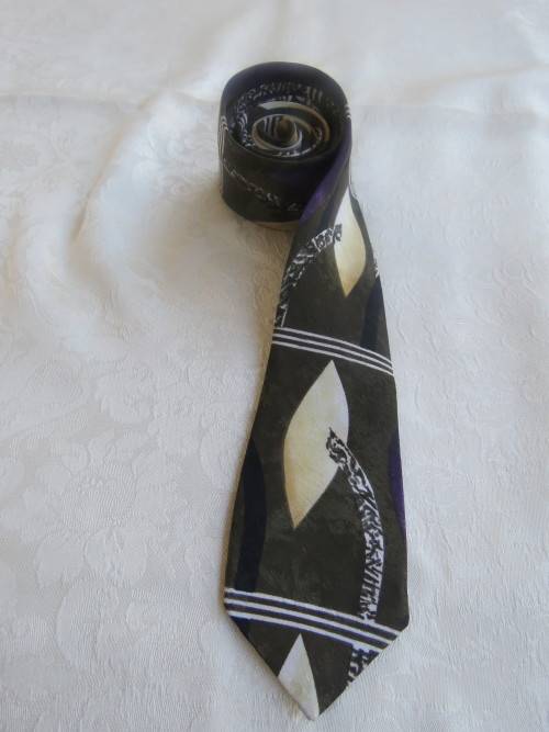 Fashionable narrow men`s necktie in dark green,cream and purple by `SLIM JIM`.Width 5.5cm.As new.