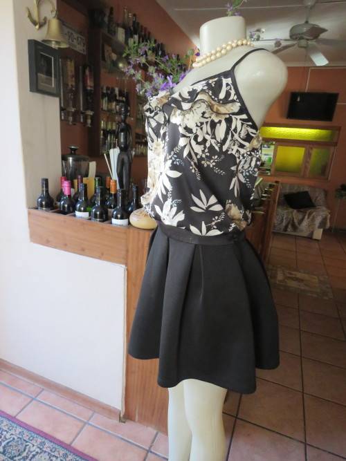 Smart strappy top in 100% silky black polyester fabric with bold beige flowers in 36/12.As new.