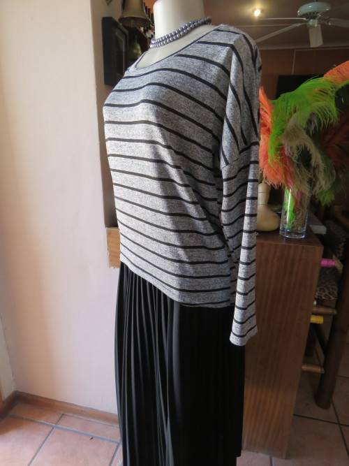 Supersoft stretch polyester pull over top in grey and black stripes.By 'IMAGES' in size 36/12.As new