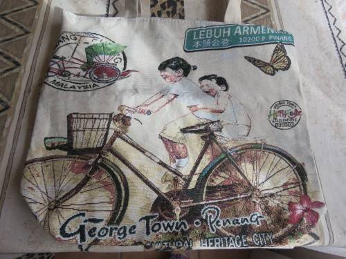 Cure cotton fabric bag from Penang Malaysia in size 44 x 39 cm.Two kids on bicycle.New bag.