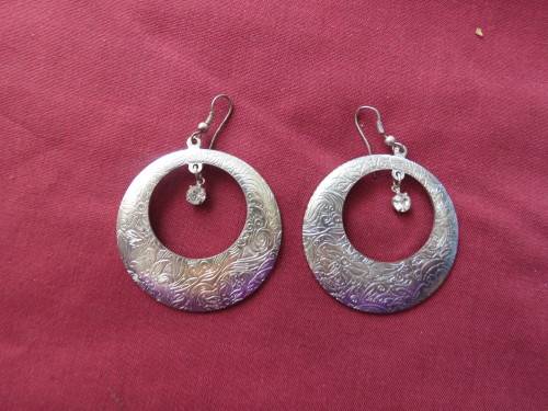 Pair of round piercing earrings with hanging faux diamond.As new.