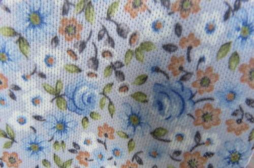 Pretty vintage summer dress in light blue with tiny darker blue, brick and white flowers. Size 38/14