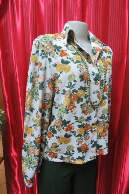 Boutique made long sleeve top size 36/12. Button down front with covered buttons and open collar.