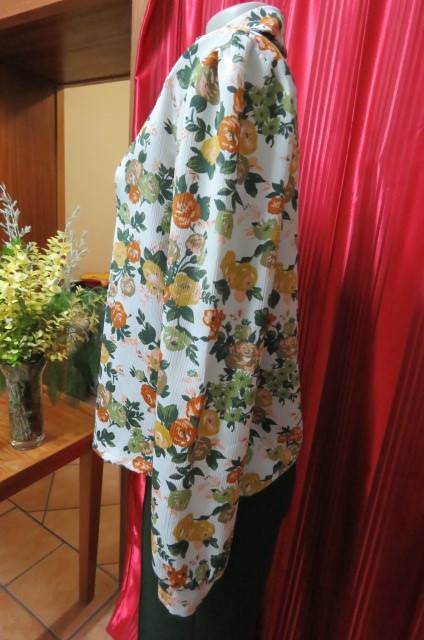 Boutique made long sleeve top size 36/12. Button down front with covered buttons and open collar.