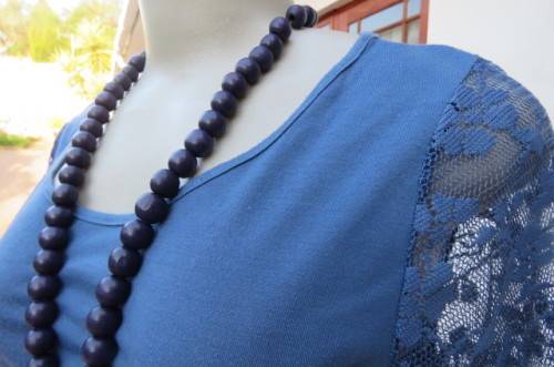 Beautiful steel blue top with scooped neckline. Bracelet length lace sleeves size 34/10 by `Tango`