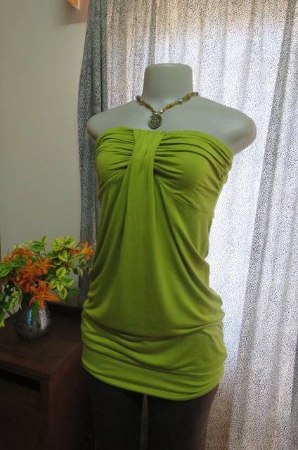 Strapless bright avogreen long top by `Woolworths` in size 34/10. Band over hips. In stretch cotton.