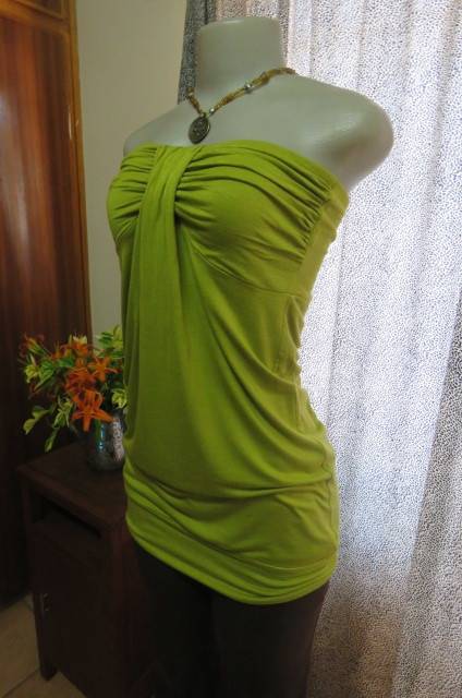 Strapless bright avogreen long top by `Woolworths` in size 34/10. Band over hips. In stretch cotton.