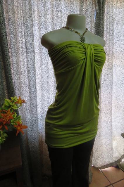 Strapless bright avogreen long top by `Woolworths` in size 34/10. Band over hips. In stretch cotton.