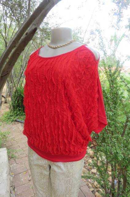 Pretty bright red top with short cut-on sleeves. Blouson style with banded waist size 42/18.