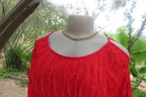 Pretty bright red top with short cut-on sleeves. Blouson style with banded waist size 42/18.