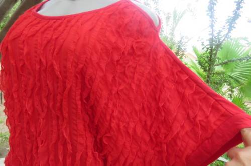 Pretty bright red top with short cut-on sleeves. Blouson style with banded waist size 42/18.