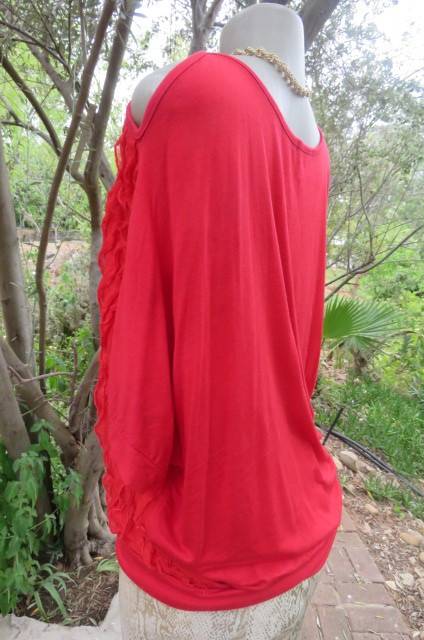 Pretty bright red top with short cut-on sleeves. Blouson style with banded waist size 42/18.