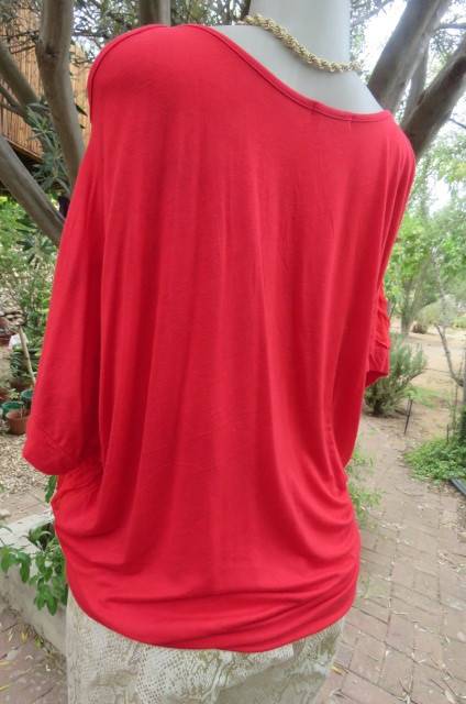 Pretty bright red top with short cut-on sleeves. Blouson style with banded waist size 42/18.