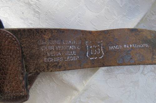 Genuine leather brown belt with holder. Length 108 cm. Made in Europe. Used but in good condition.