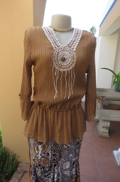 Fab light brown peplum style top in pattern creased 100% wash and wear polyester fabric.Size 36/12