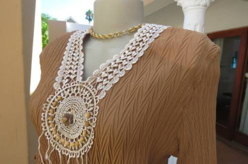 Fab light brown peplum style top in pattern creased 100% wash and wear polyester fabric.Size 36/12