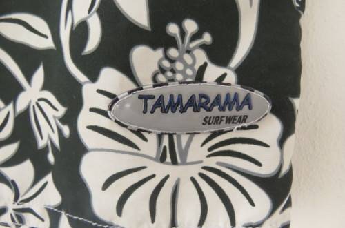 Men's black,white and grey floral TAMARAMA surf shorts in size Large. In 100% polyester fabric.